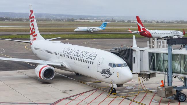 Virgin, Qantas and Cobham aircraft at Adelaide Airport last month. Picture: NCA NewsWire /Brenton Edwards