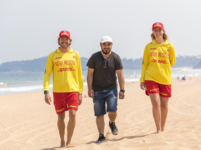 Surf lifesavers Alex Taylor and Jemima McGahey with Aref Elmustapha, who they rescued at Seven Mile Beach in Booti Booti National Park. Picture: Dylan Robinson