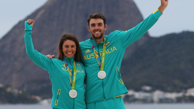 Australia’s Jason Waterhouse and Lisa Darmanin pose for a portrait in front of Sugarloaf Mountain after winning the silver medal in the Nacra 17 mixed class. Picture: Brett Costello