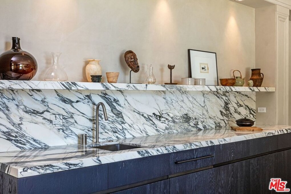 Kitchen knick knacks top the marble kitchen backsplash. Picture: Realtor