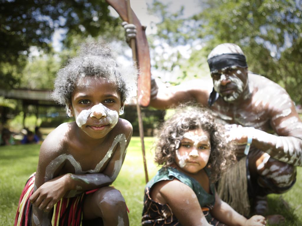 Members of the Jinibara emerging dance troupe (from left) Antwaun Bani-Ghee, 4, Megan Fisher and Hagz Fisher at the Woodford Folk Festival. Picture: Megan Slade/AAP