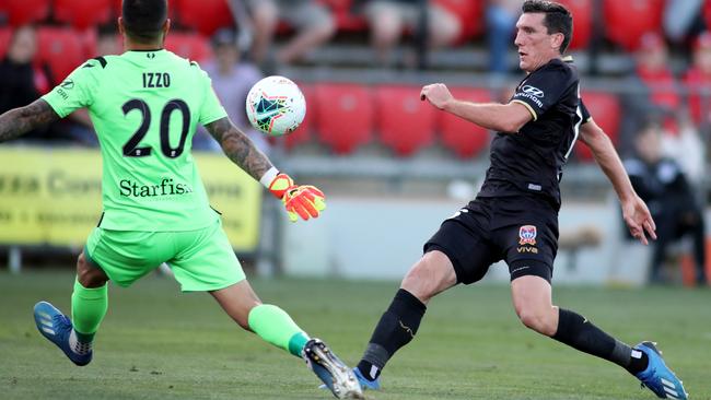 Newcastle’s Matthew Millar scores against Adelaide United at Coopers Stadium, where the Jets enjoyed a 3-0 win. Picture: AAP