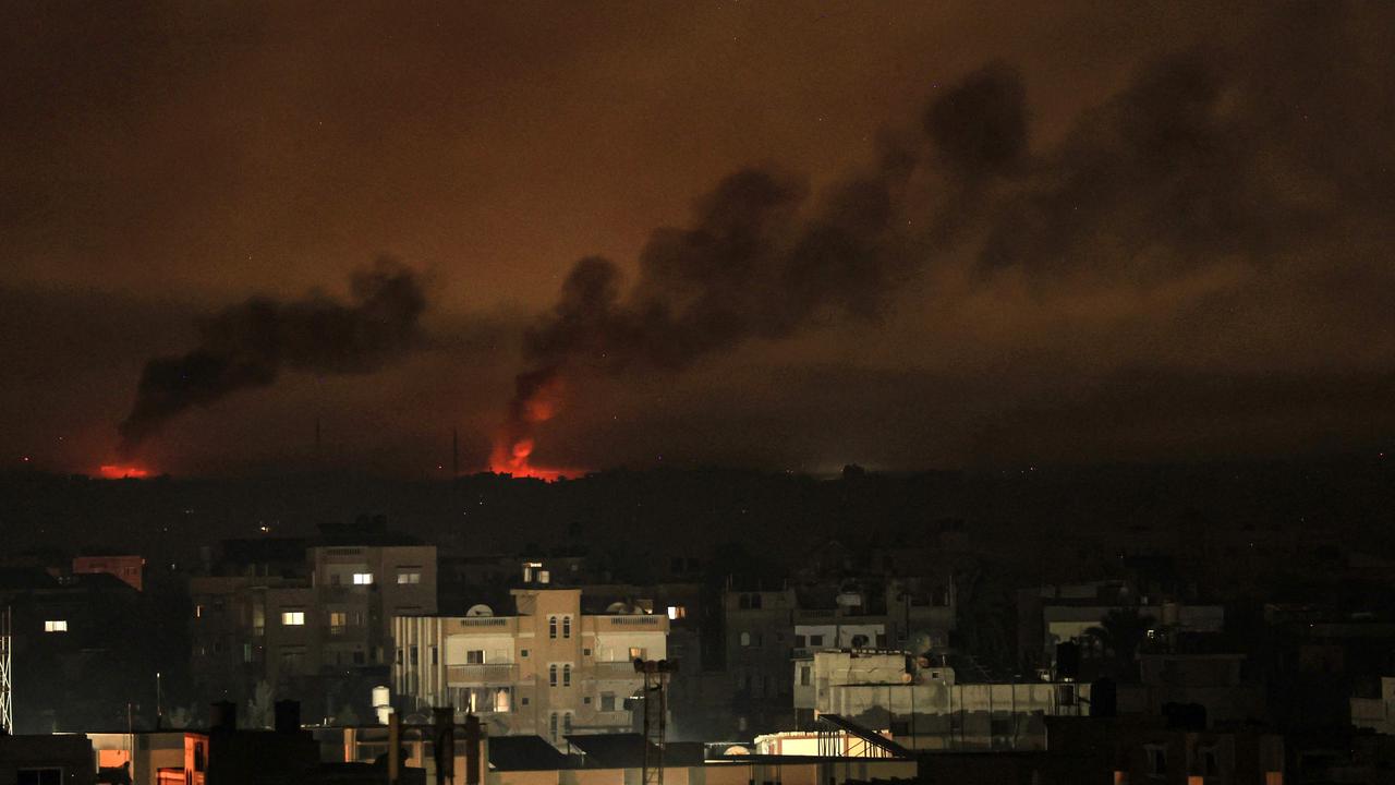 A picture taken from Rafah shows smoke billowing following Israeli bombardment of Khan Yunis in the southern Gaza Strip on December 9. Picture: Said Khatib/AFP