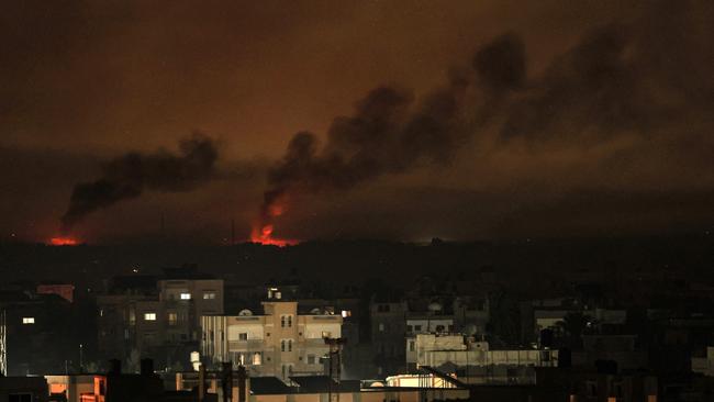 A picture taken from Rafah shows smoke billowing following Israeli bombardment of Khan Yunis in the southern Gaza Strip on December 9. Picture: Said Khatib/AFP