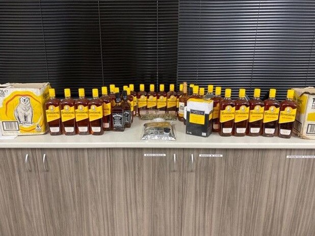 Alcohol seizes by officers from Wadeye Police Station on Thursday July 2, 2020, in a campaign targeting those taking alcohol and drugs into the community. A total of 34 bottles of liquor were seized, with 24 coming from a single vehicle. Police also found 54.1 grams of cannabis.