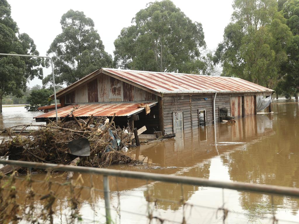 Camden a day after another flood in the area in two weeks .Phil Oliver ( cap) sevens damage on his property at 2 Exeter st Camden.