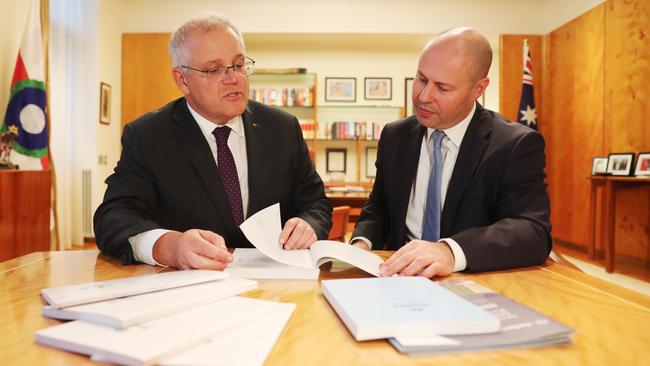 Prime Minister Scott Morrison and Treasurer Josh Frydenberg look through the Budget papers at Parliament House. Picture: Adam Taylor/PMO