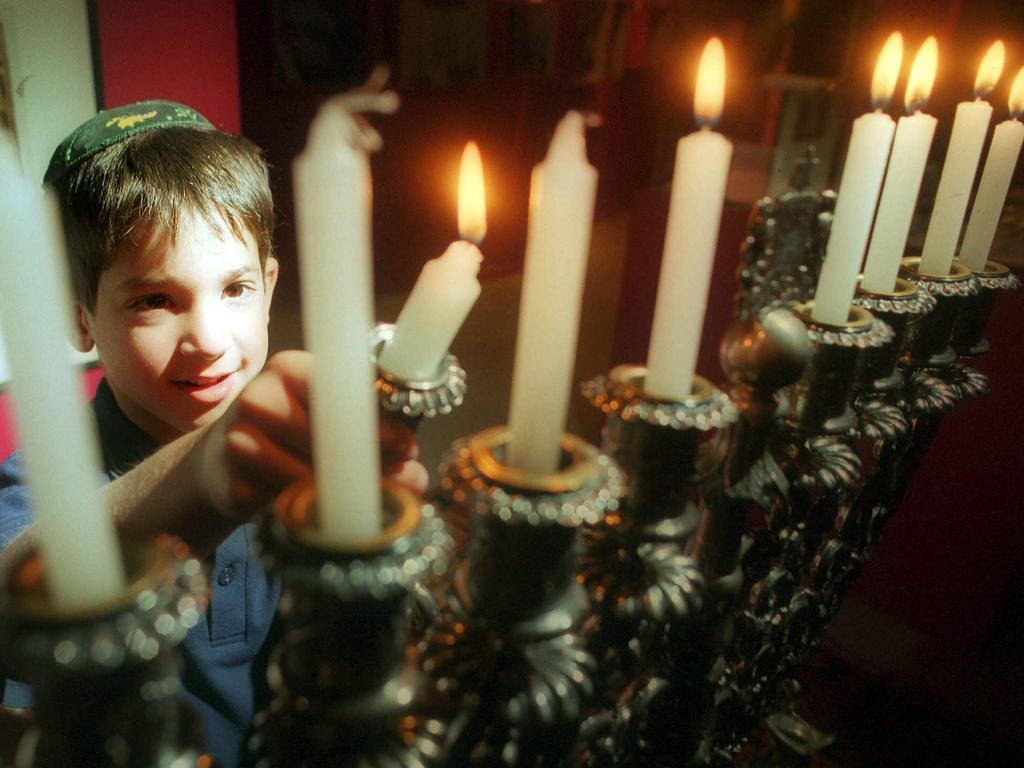 25/11/2002. Adam Schwarz gets ready for Hanukkah at the Jewish Museum.