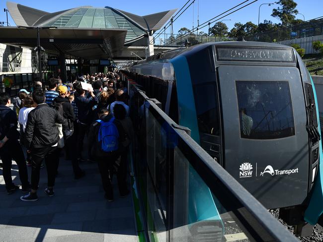 Passengers wait to board a North West Metro train at Tallawong Station in Sydney, Sunday, May 26, 2019. (AAP Image/Joel Carrett) NO ARCHIVING