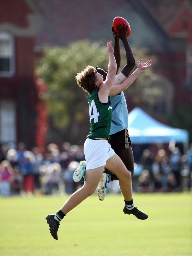 Ben Rongdit flies to take a strong mark. Picture: David Smith