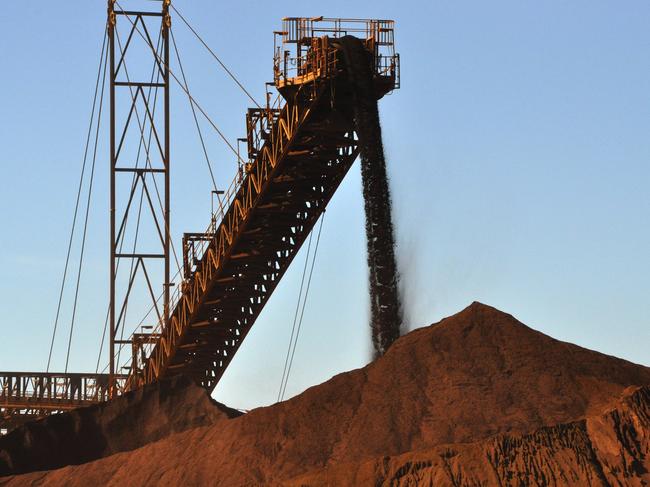 stock mining pics Iron ore being stockpiled at Fortescue Metals Group's first mine, Cloudbreak, about 280km southeast of Port Hedland in Western Australia. AAP Image/Rebecca Le May (NO ARCHIVING) * The pics were taken on a media tour on Monday.