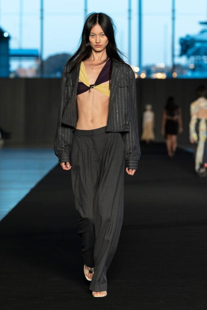 <p><em>Image credit: courtesy Bec and Bridge</em></p><p>Take Bec and Bridge: the party-focussed collection that showed on Tuesday evening, in the golden glow of the setting sun, veered between the ‘90s and the noughties, mixing frothy ruffle hems with sleek minimalism. The label’s take on suiting, too, was club-ready: a cropped, metallic-threaded jacket sat over low rise suiting pants. Who says suits are only for the boardroom? </p>