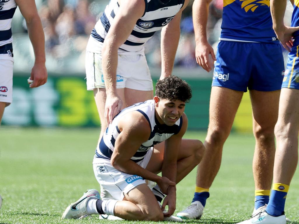 Tyson Stengle grabs his hand. Picture: James Elsby/AFL/Getty