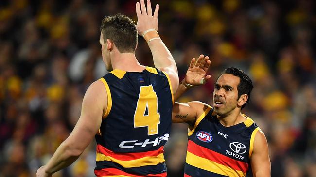 ADELAIDE, AUSTRALIA - JULY 21: Josh Jenkins is congratulated by Eddie Betts of the Crows after kicking a goal during the round 18 AFL match between the Adelaide Crows and the Geelong Cats at Adelaide Oval on July 21, 2017 in Adelaide, Australia.  (Photo by Daniel Kalisz/Getty Images)