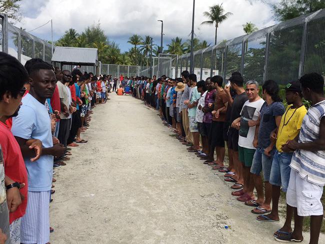 Refugees at Manus Island detention centre linked hands in solidarity ahead of the centre's closure. Picture: AAP