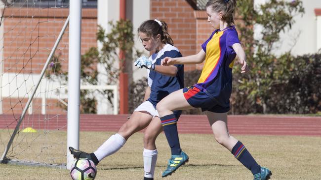 Jaci Plumpton as a football (soccer) schoolgirl ace for Kelvin Grove State College. Now she is an under-17 footy ace with the Aspley Hornets.