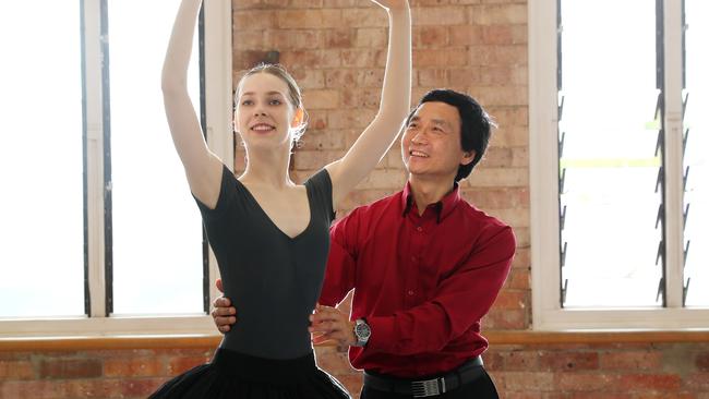 Queensland Ballet's Li Cunxin with Queensland Ballet academy student Dani Gibson. Picture: Peter Wallis