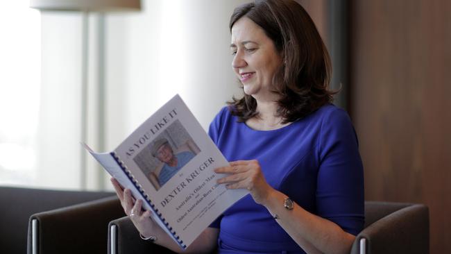 Annastacia Palaszczuk with a book by Dexter Kruger