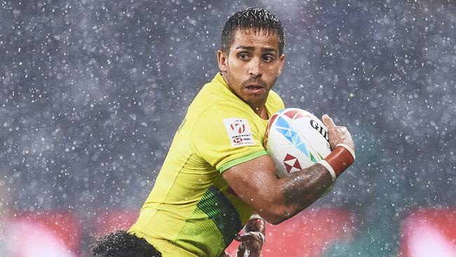 Maurice Longbottom at a very wet Sydney Sevens match between New Zealand and Australia at Bankwest Stadium in February.