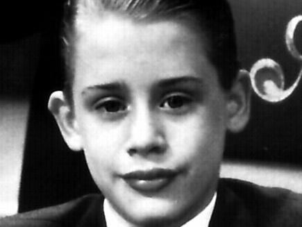 1994- Actor Macaulay Culkin (seated) & Jonathon Hyde in the film 