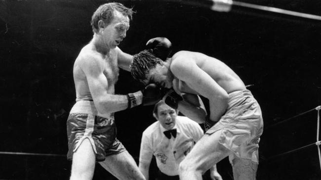 Lester Ellis wears an uppercut from Barry Michael in 1985.