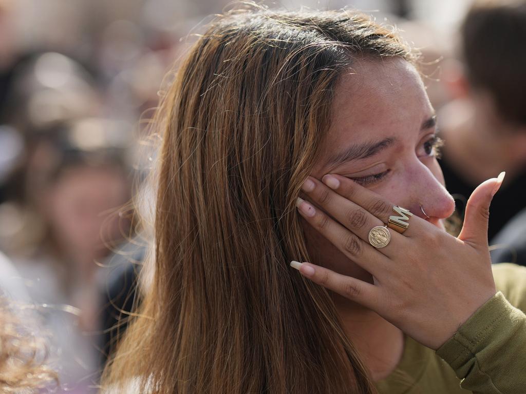 A woman tears up after seeing the coffin of Pope Francis carried through the square. Picture: AP
