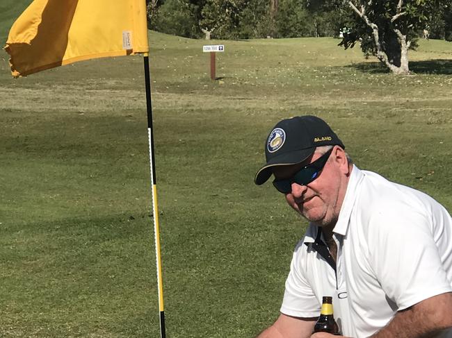 Brendan Payne holds up his ball after his hole-in-one on the 11th at Maclean Golf Club.