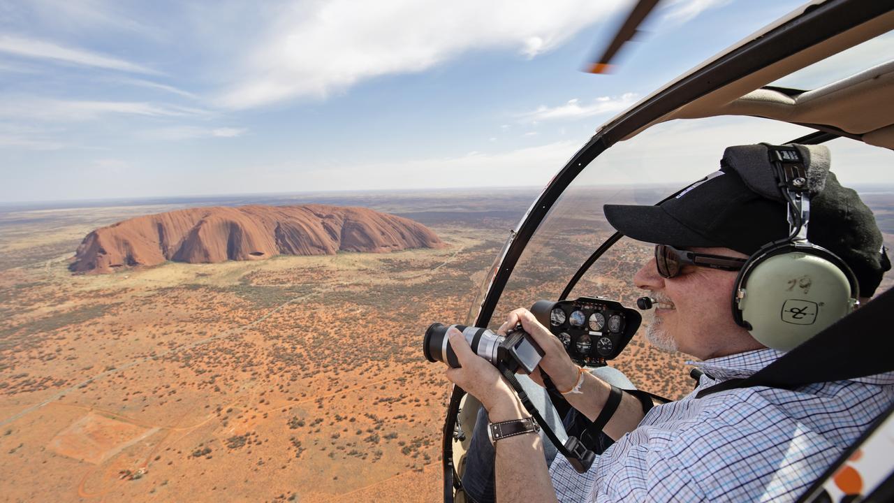 One of the best ways to view Uluru is from a helicopter.