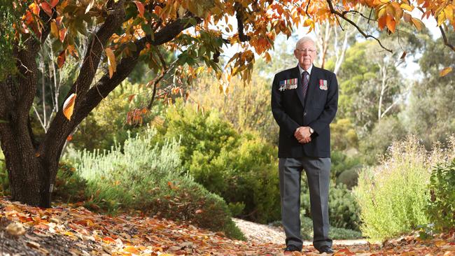 David Matthews with replica medals including the Military Cross and George Cross awarded to his father, Captain Lionel "The Duke" Matthews, who was executed as a POW by the Japanese in WWII. Picture: Tait Schmaal