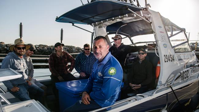 Tom Di Vittorio, of Go Get'Em Fishing Charters, with some clients at the West Beach boat ramp on Saturday morning. Picture: AAP Image/ Morgan Sette