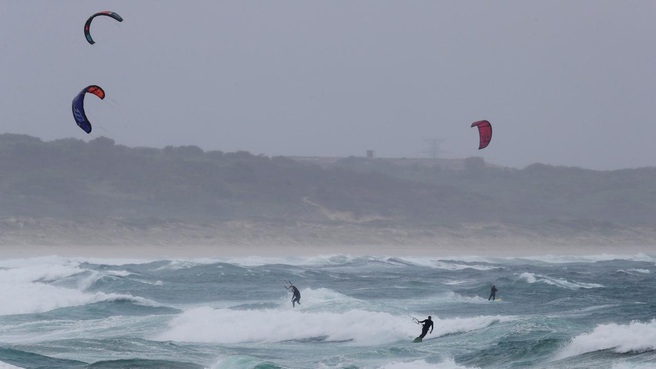 Kitesurfers braving wild conditions at Cronulla on Wednesday morning. Picture: Brett Costello