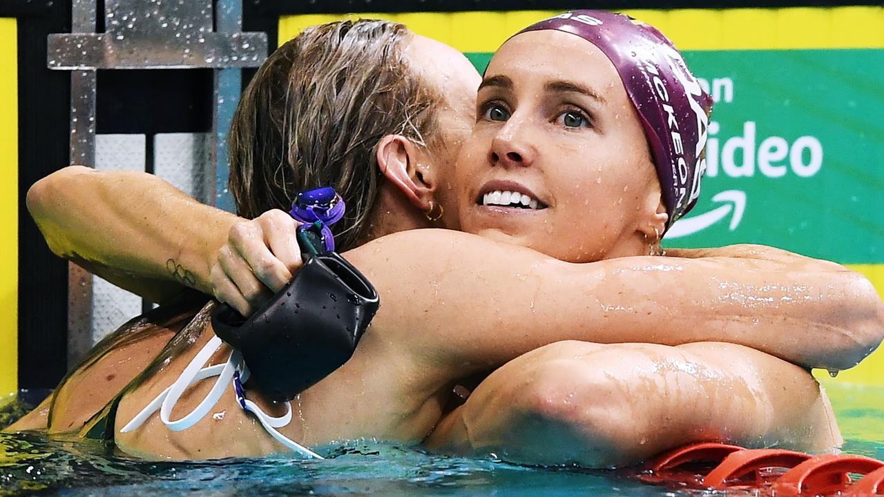 Madison Wilson hugs Emma McKeon (right), who she replaces in the 200m freestyle in Tokyo on account of McKeon’s extensive program.