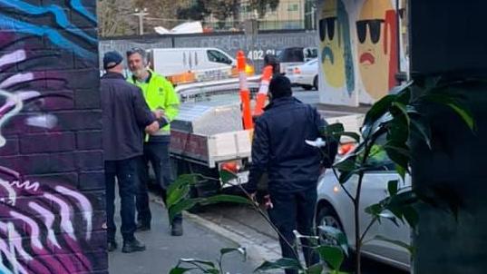 A Stonnington parking inspector allegedly fined another council worker planting trees in Barry St, South Yarra on June 4. Picture: Supplied.