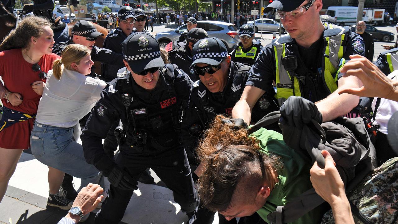 A protester is arrested. Picture: William West/AFP