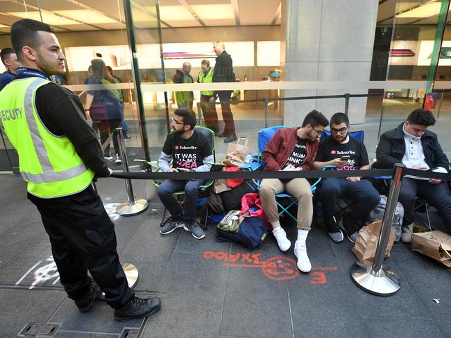 Customers wait in line for new products at the Apple Store in Sydney, Friday, September 22, 2017. Tech giant Apple have today released the iPhone 8 and iPhone 8 Plus smartphones. (AAP Image/Joel Carrett) NO ARCHIVING