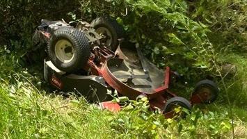 The upturned mower which Stu Battle spent three hours trapped under. Picture: Supplied.