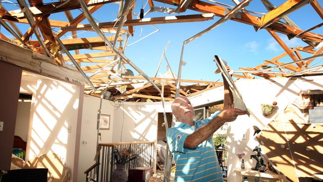 Trevor Hickey survey his damaged home.