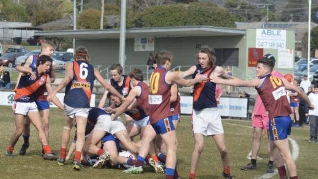 Riley (right) sticking up for Bailey Humphrey while the pair played for the Moe Lions. Picture: Supplied