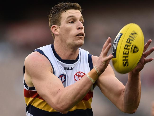 Josh Jenkins of the Crows contests during the Round 15 AFL match between the Melbourne Demons and the Adelaide Crows at the MCG in Melbourne, Sunday, July 3, 2016. (AAP Image/Julian Smith) NO ARCHIVING, EDITORIAL USE ONLY