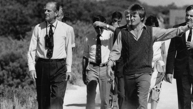 Ranger Mark Brewerton (R) Prince Philip on a tour of the St Kilda mangroves in South Australia 1986.