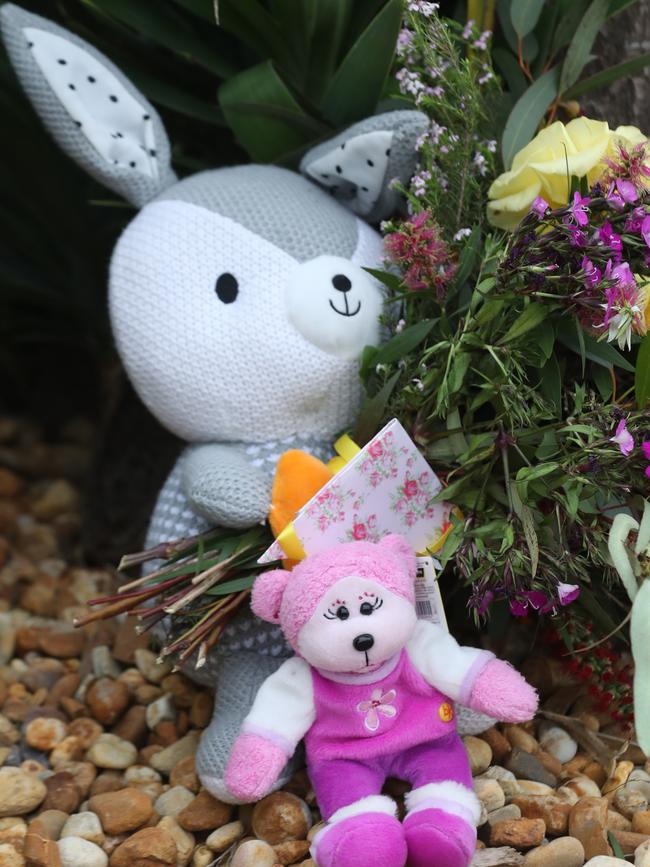 Toys and flowers at the scene of the tragic incident. Picture: David Crosling