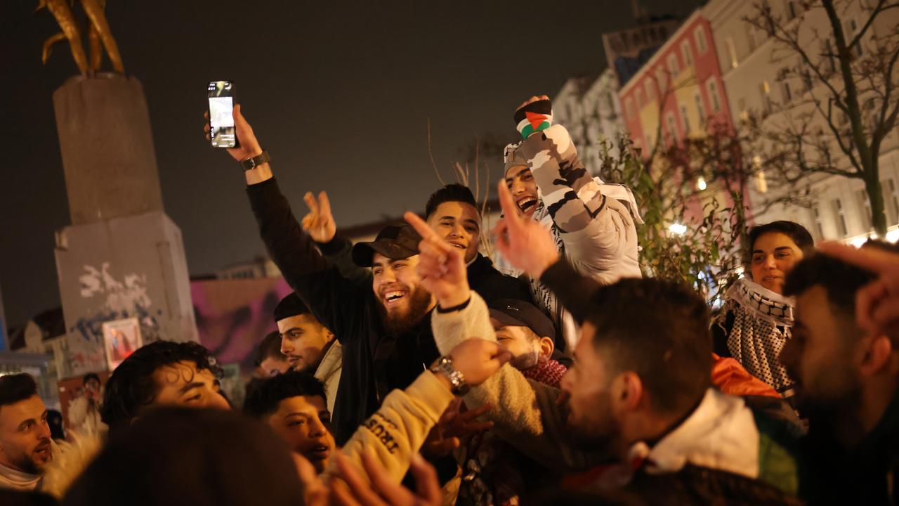 Young Arab men celebrate the announcement of the Gaza ceasefire on January 15, 2025 in Berlin, Germany. (Photo by Sean Gallup/Getty Images)