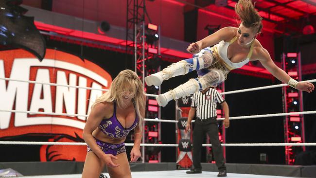 Ripley takes to the air against Charlotte Flair at last year’s WrestleMania. Picture: WWE (2021).