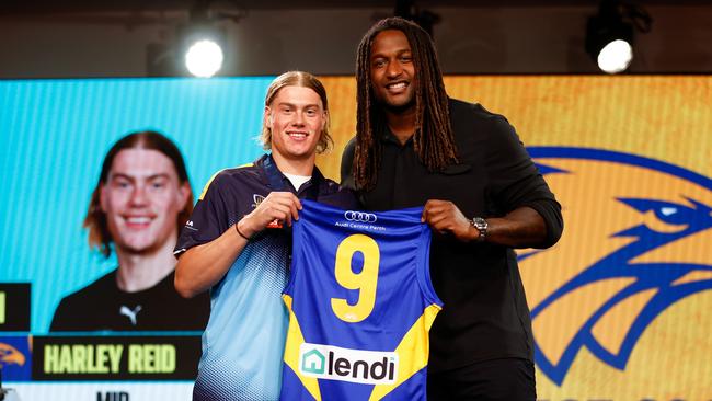 MELBOURNE, AUSTRALIA - NOVEMBER 20: Harley Reid is presented with his jumper by Nic Naitanui of the Eagles after being selected with the number 1 pick by the West Coast Eagles during the 2023 AFL Draft at Marvel Stadium on November 20, 2023 in Melbourne, Australia. (Photo by Michael Willson/AFL Photos via Getty Images)