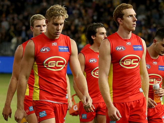 PERTH, AUSTRALIA - APRIL 14: The Suns after their loss during the round four AFL match between the West Coast Eagles and the Gold Coast Suns at Optus Stadium on April 14, 2018 in Perth, Australia. (Photo by James Elsby/Getty Images)