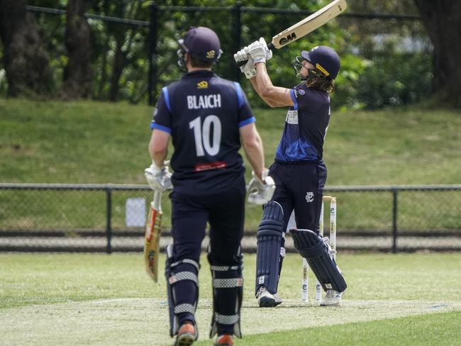 Premier: Prahran batsman Lachlan Bangs hits a ball across the street. Picture: Valeriu Campan