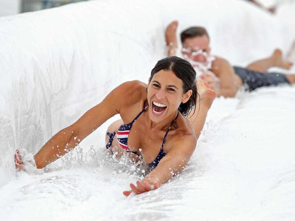 Jacqui Green, 30, from The Entrance, enjoys a thrilling Australia Day ride down one of the three 400M waterslides at Slideapalooza in the Calais Estate Winery at Pokolbin in the NSW Hunter Valley. Picture: Troy Snook