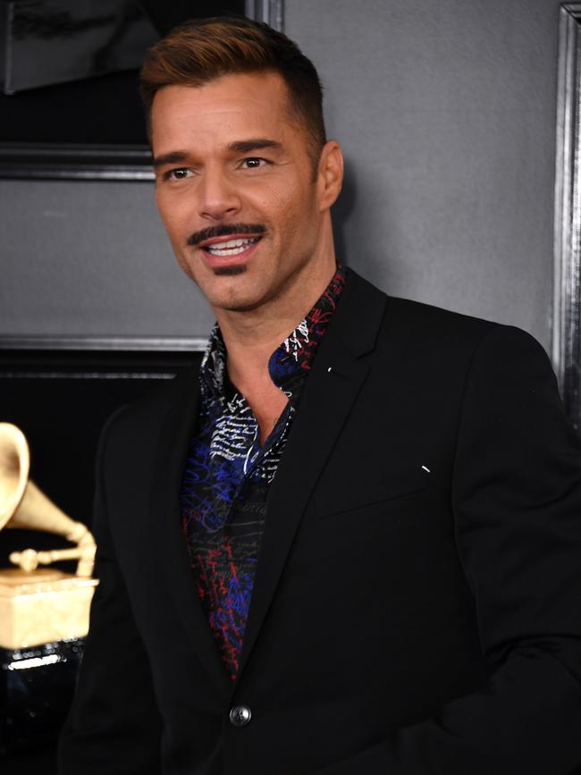 Sporting a mo … Ricky Martin arrives for the Grammy Awards, where he’ll appear on stage. Picture: AFP