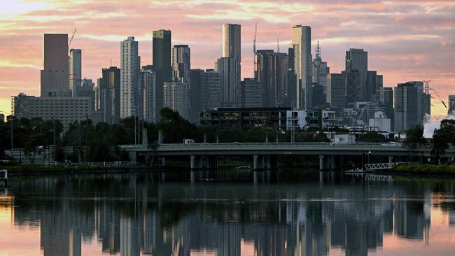 The Melbourne skyline in reflected in the Maribyrnong River in the early morning light on April 18, 2023. - Melbourne has officially become Australia's most populous city after an adjustment to the city boundaries which saw its population jump to 4,875,400, almost 19,000 more than Sydney, according to Australia's Bureau of Statistics. (Photo by William WEST / AFP)