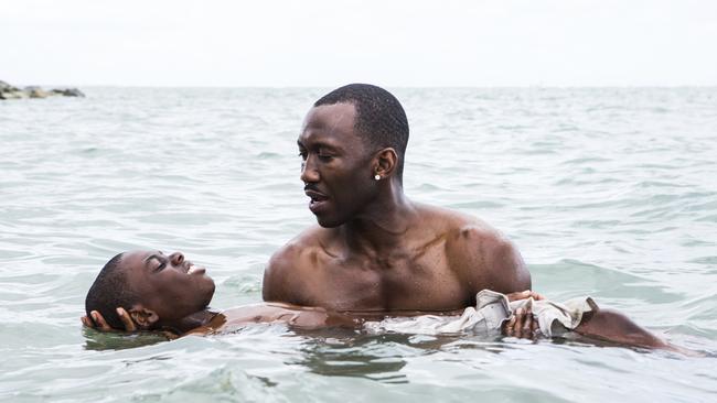 Alex Hibbert, left, and Mahershala Ali in a scene from <i>Moonlight.</i>